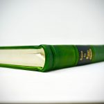 Green leather book with silk ribbon, custom made by Boston Harbor Bookbindery