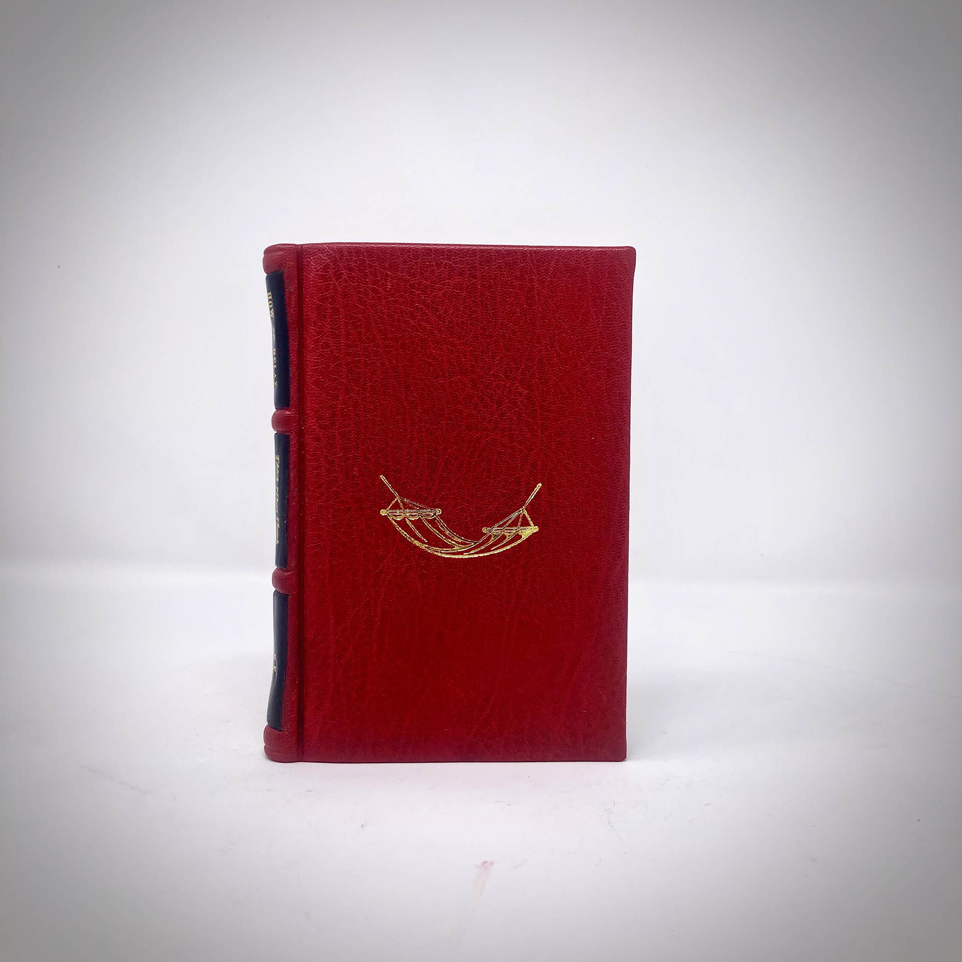 Boston Harbor Bookbindery
www.bostonharborbooks.com

How to Relax; Custom red leather book, designed and executed for the client’s personal library as one fo their all-time favorite books.